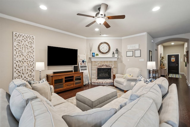 8332 Trickham Bnd, Fort Worth, TX 76131 - living area with arched walkways, ceiling fan, wood finished floors, crown molding, and recessed lighting