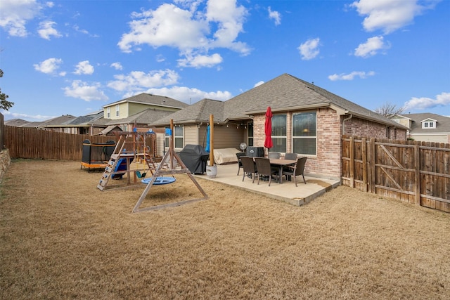 8332 Trickham Bnd, Fort Worth, TX 76131 - back of house with a patio, brick siding, and a shingled roof