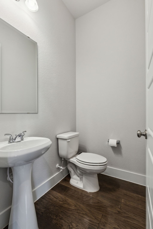 1108 Sandgate Dr, Forney, TX 75126 - half bathroom with baseboards, toilet, and wood finished floors