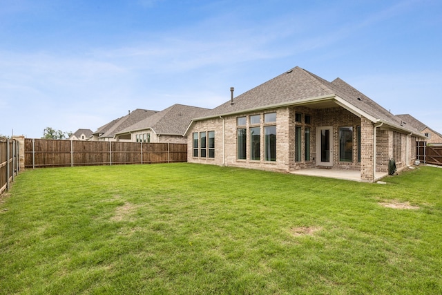 1108 Sandgate Dr, Forney, TX 75126 - back of house featuring brick siding, a patio, and roof with shingles