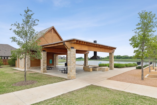 1108 Sandgate Dr, Forney, TX 75126 - surrounding community with a lawn, a water view, and a patio