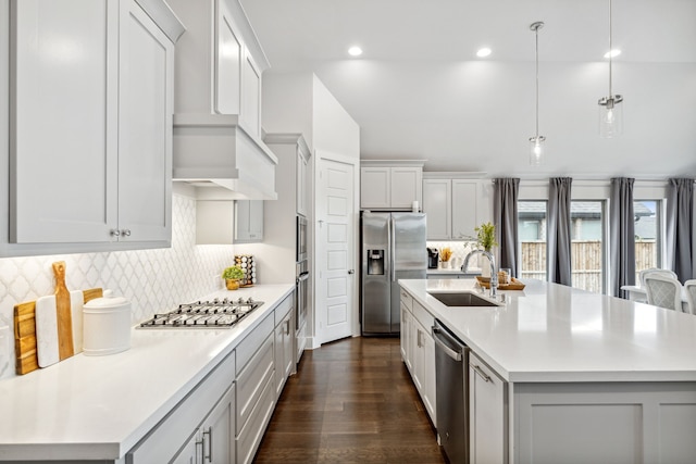 1108 Sandgate Dr, Forney, TX 75126 - kitchen with stainless steel appliances, a sink, light countertops, backsplash, and recessed lighting