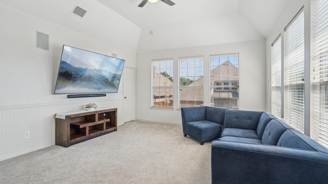 2026 Spindletop Trl, Frisco, TX 75033 - living room featuring ceiling fan, light carpet, lofted ceiling, baseboards, and wainscoting