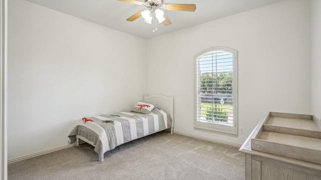 2026 Spindletop Trl, Frisco, TX 75033 - bedroom featuring multiple windows, light colored carpet, baseboards, and ceiling fan