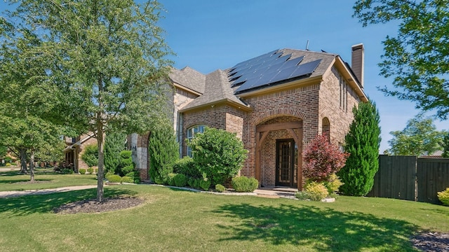 2026 Spindletop Trl, Frisco, TX 75033 - view of front of property with brick siding, a chimney, and solar panels