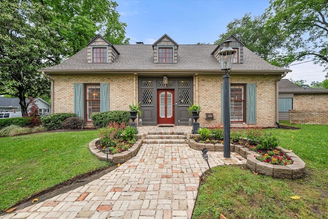 1111 Governors Dr, Corsicana, TX 75110 - view of front facade with a front yard, brick siding, and a shingled roof