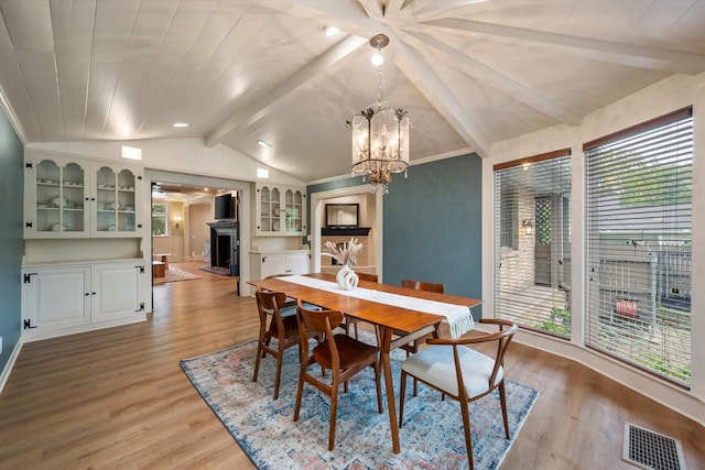 1111 Governors Dr, Corsicana, TX 75110 - dining space featuring a fireplace, healthy amount of natural light, and light wood-style floors