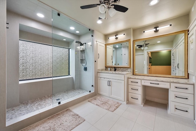 1111 Governors Dr, Corsicana, TX 75110 - bathroom featuring a ceiling fan, a tile shower, vanity, tile patterned floors, and recessed lighting