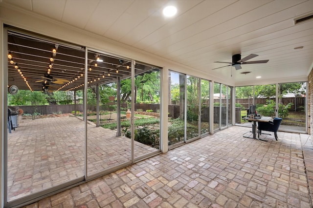 1111 Governors Dr, Corsicana, TX 75110 - unfurnished sunroom featuring ceiling fan and plenty of natural light