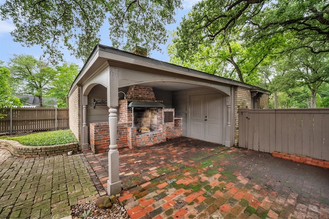 1111 Governors Dr, Corsicana, TX 75110 - view of patio / terrace featuring a fireplace and fence