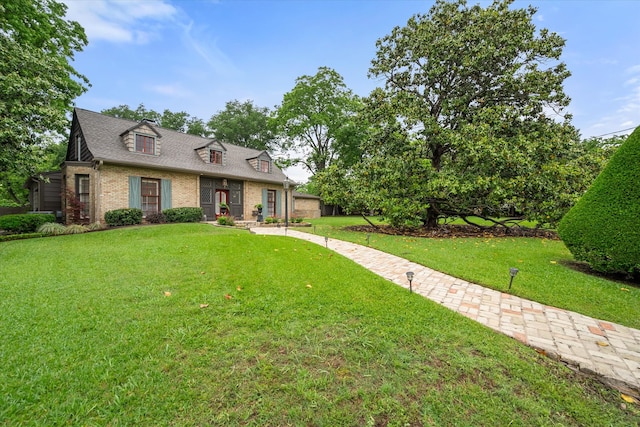 1111 Governors Dr, Corsicana, TX 75110 - view of front of house with brick siding, a front yard, and a shingled roof
