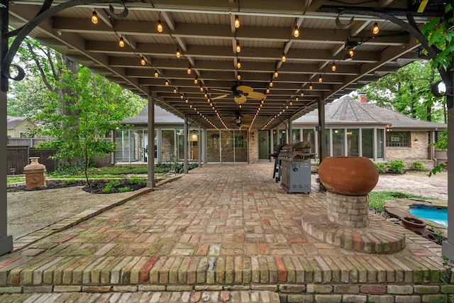 1111 Governors Dr, Corsicana, TX 75110 - view of patio with fence, a grill, a sunroom, and ceiling fan
