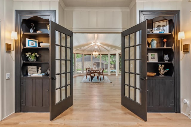 1111 Governors Dr, Corsicana, TX 75110 - entryway featuring wood finished floors, a chandelier, and ornamental molding