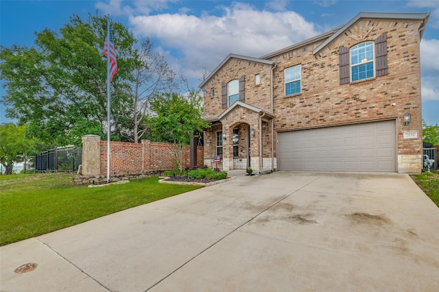 traditional-style house with a garage, concrete driveway, and brick siding