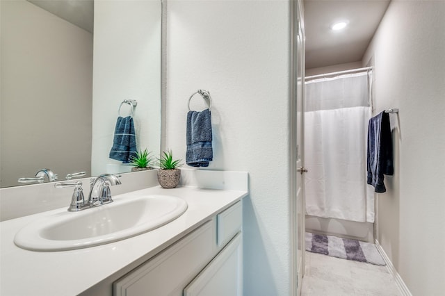 full bath featuring vanity and shower / bath combo with shower curtain