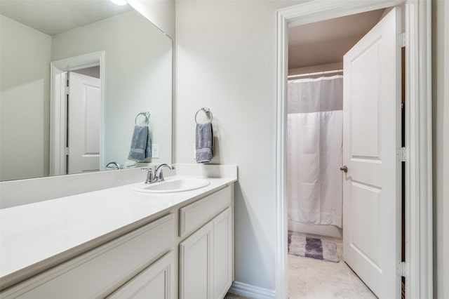 bathroom featuring vanity and a shower with shower curtain