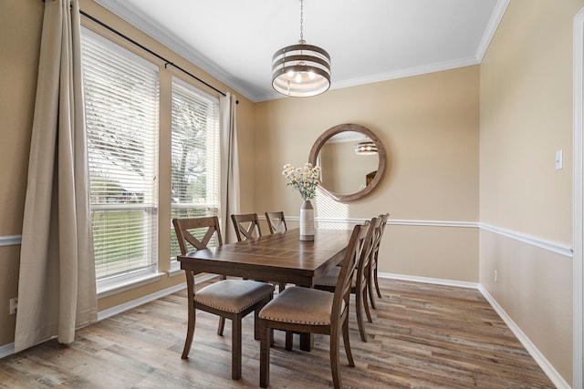 11448 Brook Green Ln, Haslet, TX 76052 - dining area with a chandelier, ornamental molding, wood finished floors, and baseboards