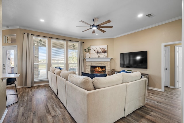 11448 Brook Green Ln, Haslet, TX 76052 - living area featuring a ceiling fan, baseboards, wood finished floors, ornamental molding, and a fireplace