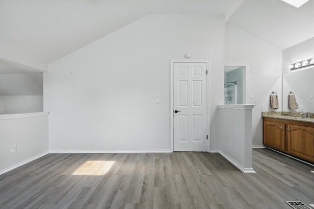 2755 Harbinger Ln, Dallas, TX 75287 - bonus room featuring lofted ceiling, light wood-type flooring, and baseboards