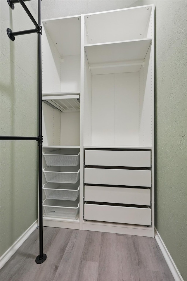 2755 Harbinger Ln, Dallas, TX 75287 - spacious closet featuring wood finished floors