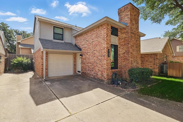 2755 Harbinger Ln, Dallas, TX 75287 - traditional-style home with concrete driveway, fence, brick siding, and an attached garage