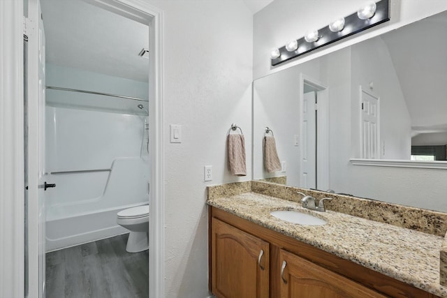 2755 Harbinger Ln, Dallas, TX 75287 - bathroom featuring wood finished floors, toilet, vanity, and shower / bath combination
