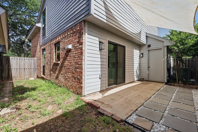 2755 Harbinger Ln, Dallas, TX 75287 - view of side of property with brick siding, a patio, fence, and cooling unit