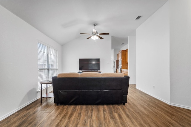 10149 Red Bluff Ln, Fort Worth, TX 76177 - living area featuring wood finished floors, ceiling fan, baseboards, and vaulted ceiling