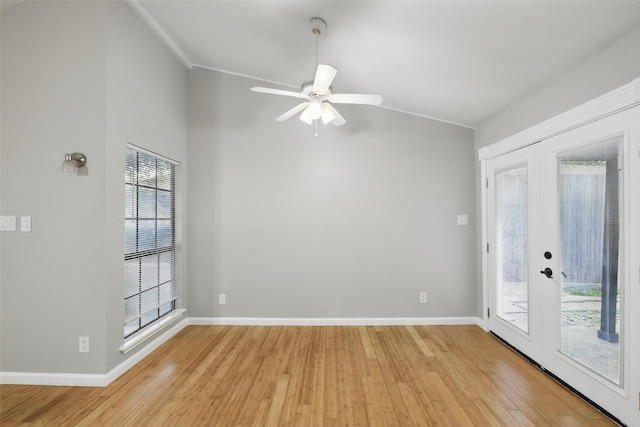 4620 Carr St, The Colony, TX 75056 - unfurnished room with vaulted ceiling, light wood-style flooring, french doors, and baseboards