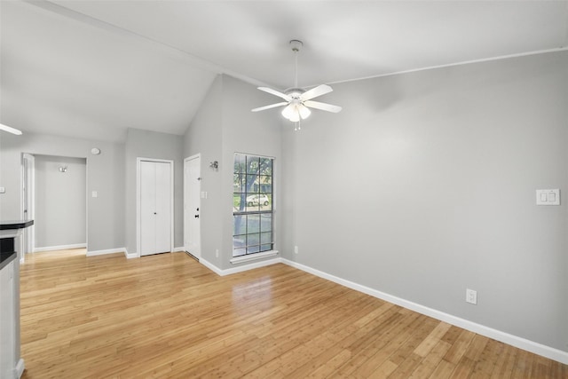 4620 Carr St, The Colony, TX 75056 - unfurnished living room featuring a ceiling fan, baseboards, light wood-type flooring, and lofted ceiling
