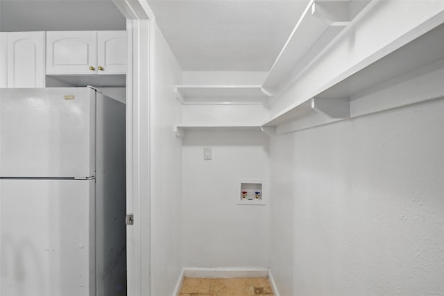 4620 Carr St, The Colony, TX 75056 - laundry area featuring washer hookup, baseboards, and cabinet space