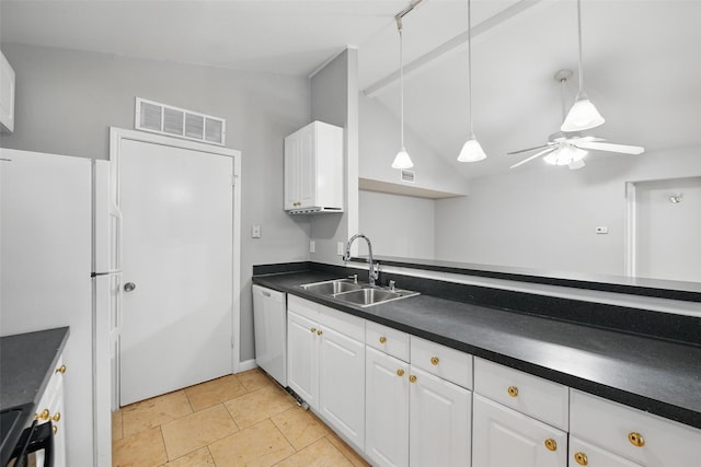 4620 Carr St, The Colony, TX 75056 - kitchen featuring white appliances, a sink, dark countertops, vaulted ceiling, and white cabinetry