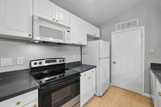 4620 Carr St, The Colony, TX 75056 - kitchen featuring white appliances, white cabinetry, dark countertops, and lofted ceiling