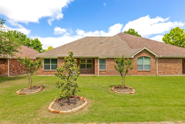 1316 Shinnecock Ct, Fairview, TX 75069 - back of property featuring a shingled roof, a lawn, and brick siding