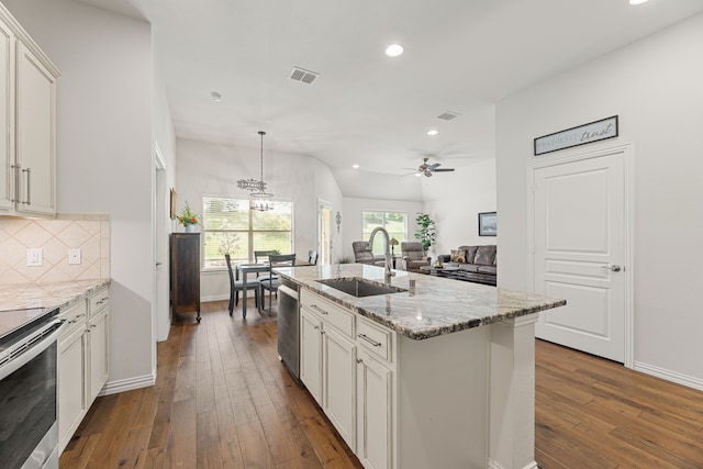 1316 Shinnecock Ct, Fairview, TX 75069 - kitchen with a sink, stainless steel appliances, recessed lighting, dark wood-type flooring, and decorative backsplash