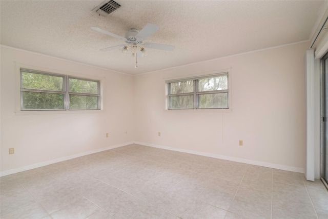 321 Evangeline Dr, Elm Grove, LA 71051 - empty room featuring a textured ceiling, a ceiling fan, light tile patterned floors, crown molding, and baseboards
