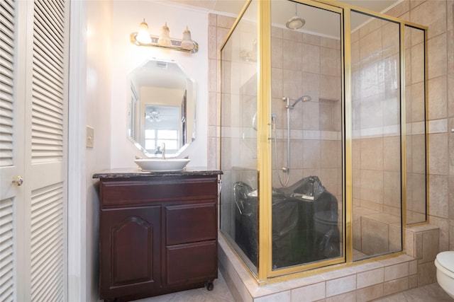 321 Evangeline Dr, Elm Grove, LA 71051 - bathroom with a closet, toilet, a stall shower, vanity, and tile patterned flooring