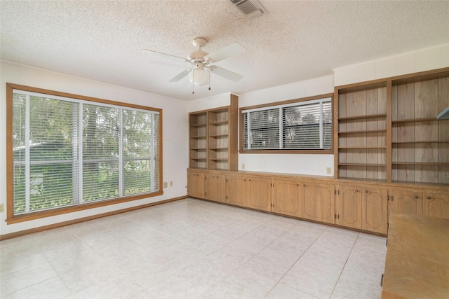 321 Evangeline Dr, Elm Grove, LA 71051 - unfurnished room with ceiling fan, a textured ceiling, and light tile patterned flooring