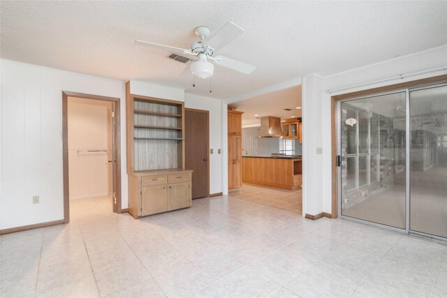 321 Evangeline Dr, Elm Grove, LA 71051 - unfurnished living room featuring a ceiling fan, baseboards, a textured ceiling, and light tile patterned flooring