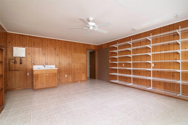 321 Evangeline Dr, Elm Grove, LA 71051 - spare room featuring ceiling fan, wood walls, crown molding, a sink, and light tile patterned floors