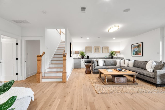 4525 E Cove Ct, Malakoff, TX 75148 - living area featuring wet bar, light wood-type flooring, stairs, and recessed lighting