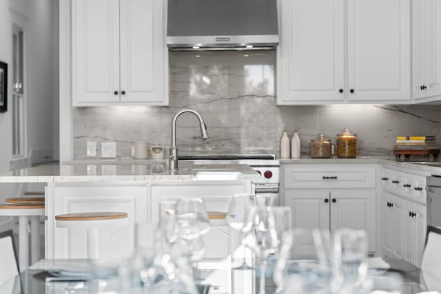 4525 E Cove Ct, Malakoff, TX 75148 - kitchen featuring tasteful backsplash, extractor fan, and white cabinetry