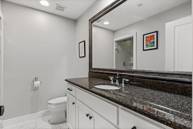 4144 Emerson Ave Unit 2, University Park, TX 75205 - full bathroom featuring marble look tiles, baseboards, toilet, vanity, and recessed lighting