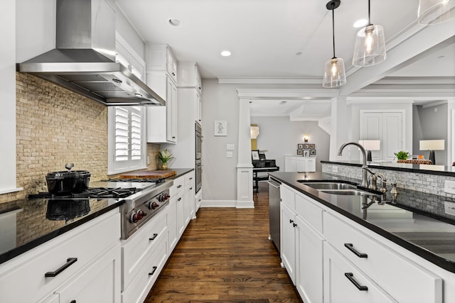 4144 Emerson Ave Unit 2, University Park, TX 75205 - kitchen with a sink, wall chimney exhaust hood, decorative backsplash, appliances with stainless steel finishes, and recessed lighting