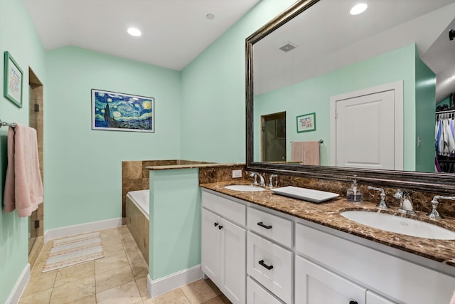 4144 Emerson Ave Unit 2, University Park, TX 75205 - bathroom with baseboards, double vanity, a shower, a tub to relax in, and tile patterned flooring