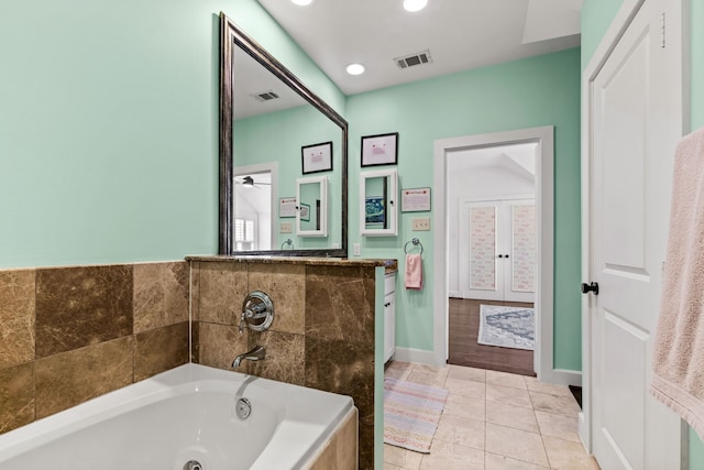 4144 Emerson Ave Unit 2, University Park, TX 75205 - bathroom with a tub with jets, tile patterned floors, recessed lighting, and baseboards