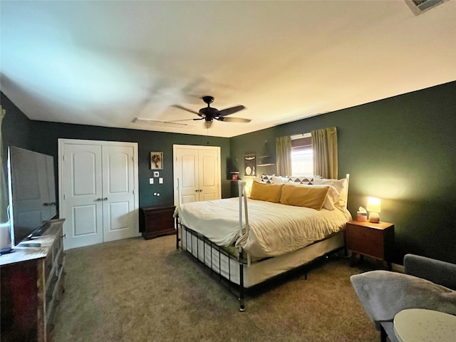 2315 Boyd St, Dallas, TX 75224 - bedroom featuring two closets, carpet flooring, and ceiling fan