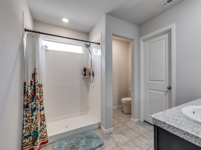 16757 Portage St, Justin, TX 76247 - full bathroom featuring toilet, tiled shower, tile patterned flooring, and vanity