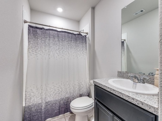 16757 Portage St, Justin, TX 76247 - full bathroom featuring toilet, vanity, and tile patterned floors