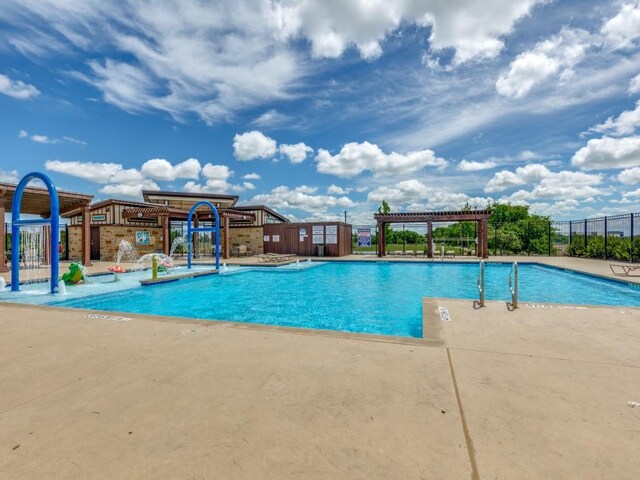 16757 Portage St, Justin, TX 76247 - community pool with fence, a patio area, and a pergola